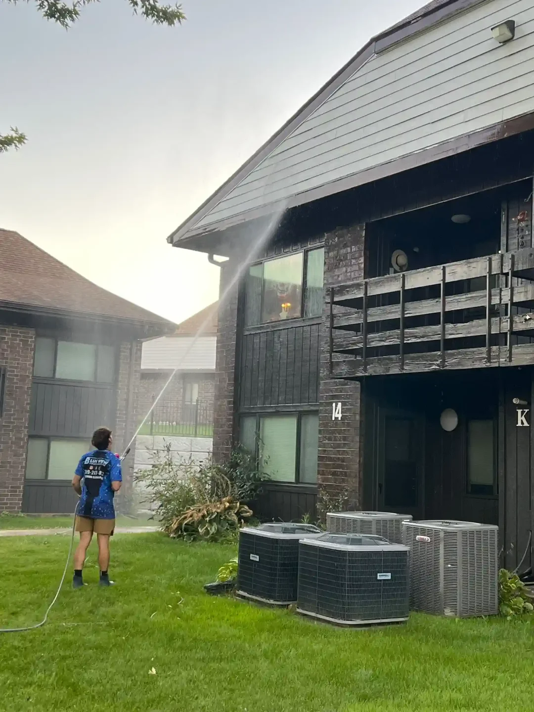 Pressure washing an apartment complex in Peoria, IL.