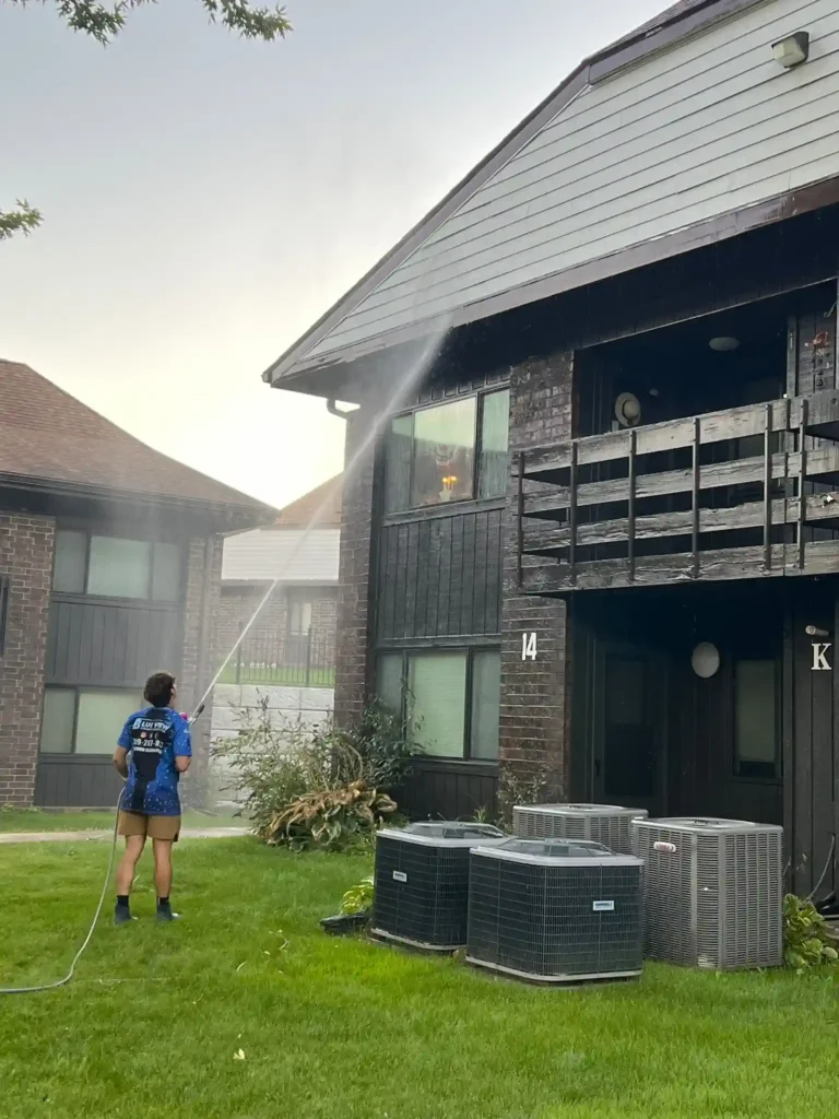 Pressure washing an apartment complex in Peoria, IL.
